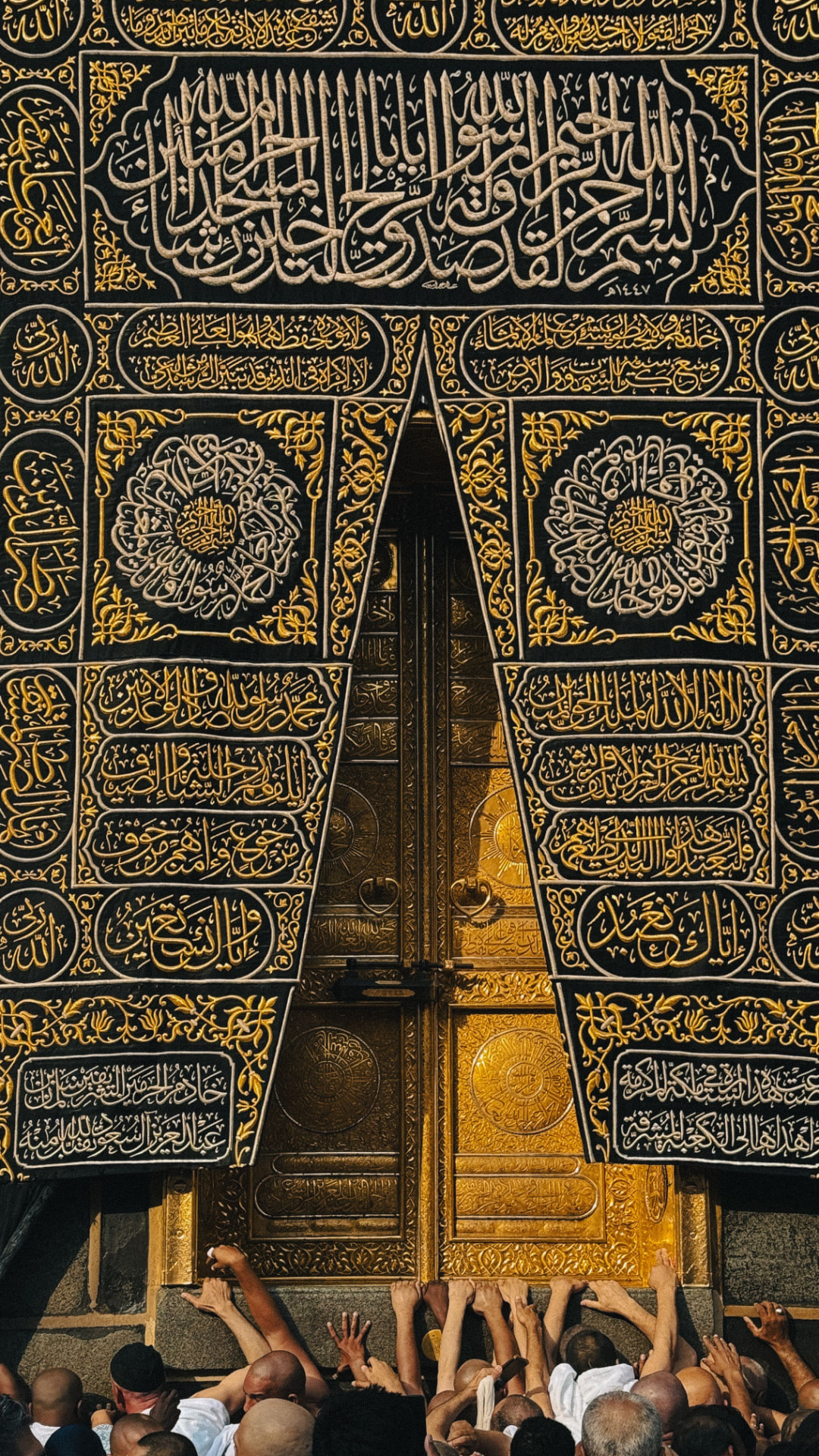 Golden door of the Kaaba with pilgrims reaching towards it