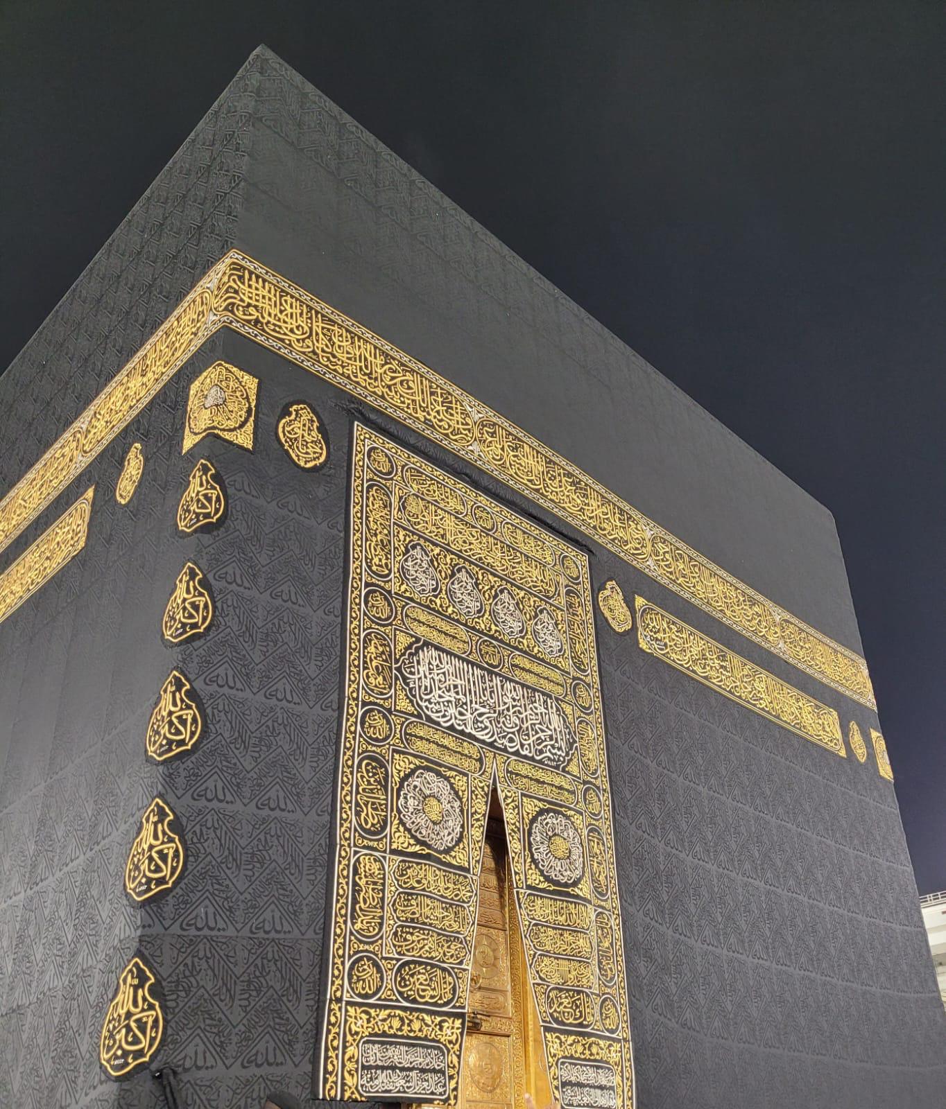 The Kaaba's golden door and calligraphy on the kiswah at night