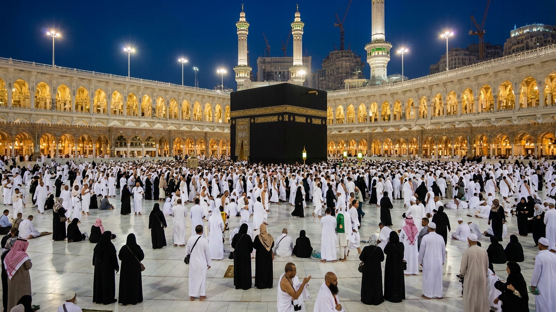 The illuminated courtyard of Masjid al-Haram at night