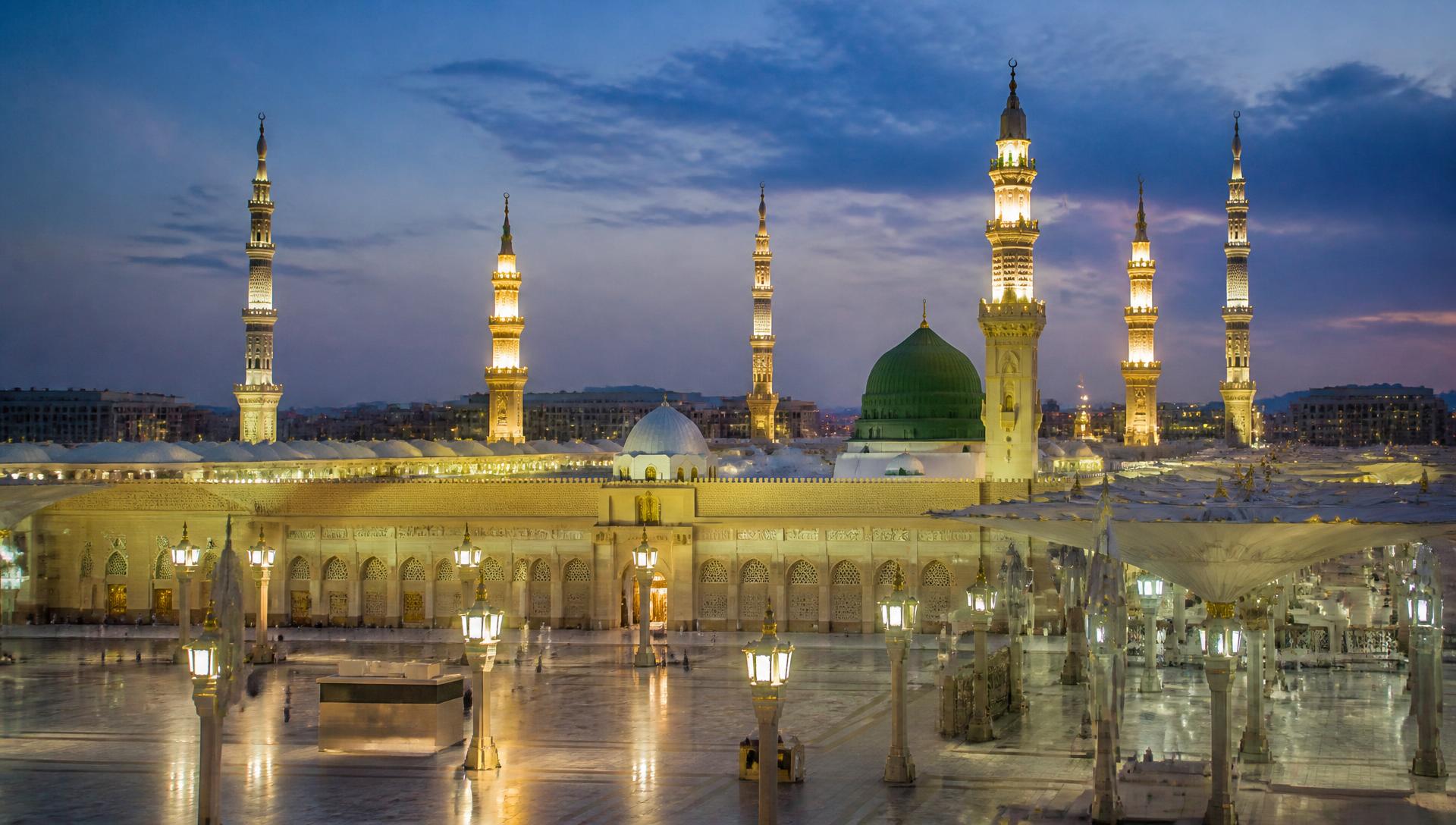Masjid an-Nabawi in Madinah with its green dome at blue hour