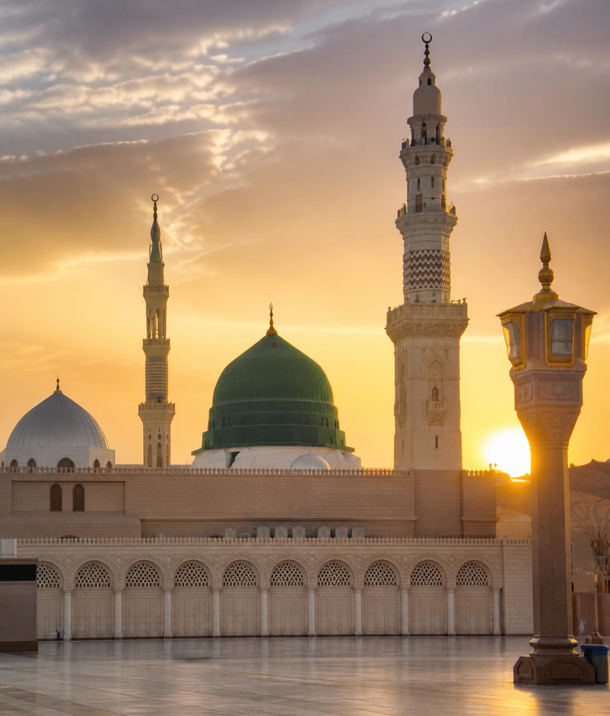 Masjid an-Nabawi in Madina with its green dome at golden hour
